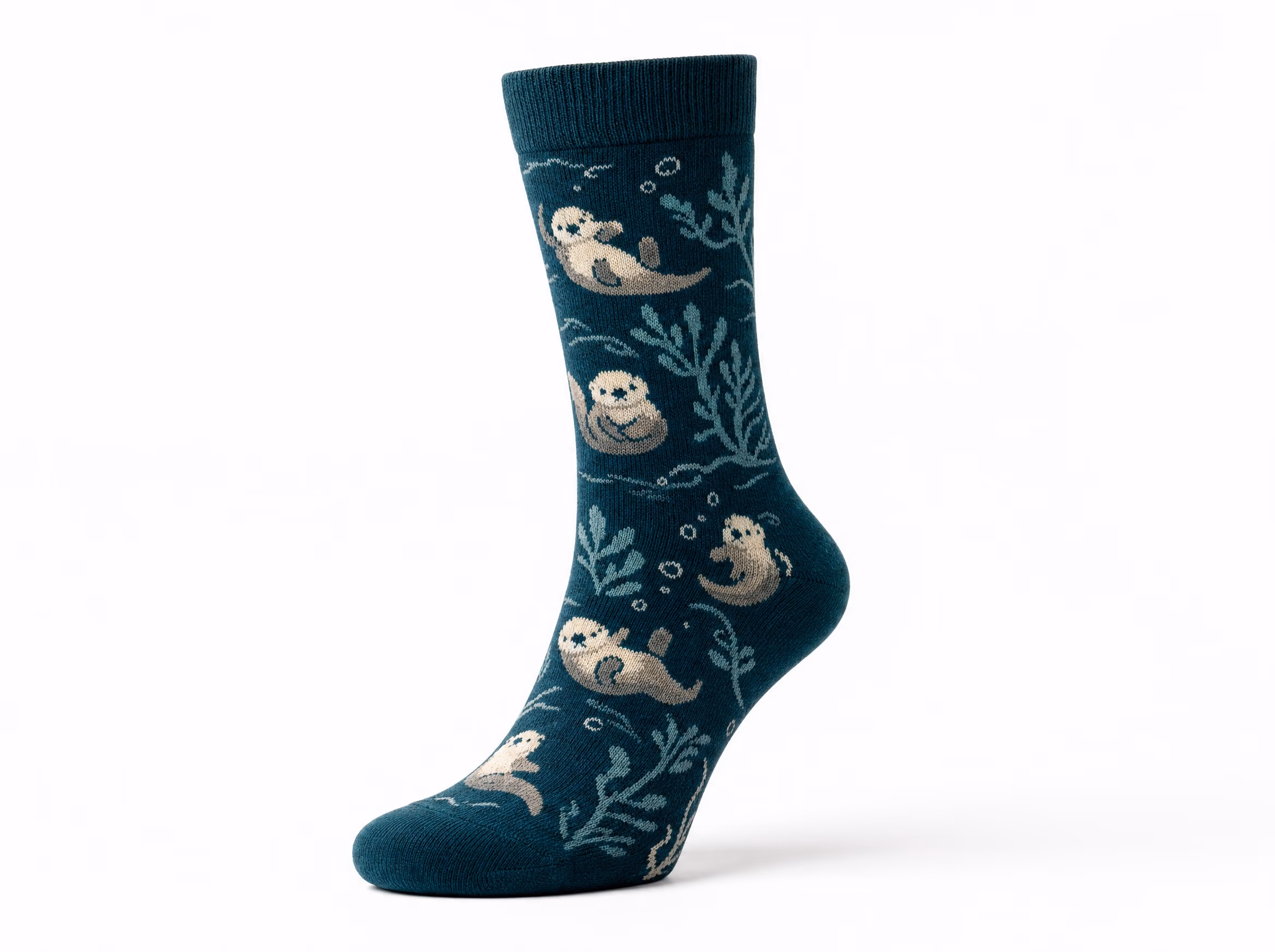 A single deep-teal novelty crew sock with a knit-in sea-otter and kelp pattern in cream, shown standalone on a white studio background