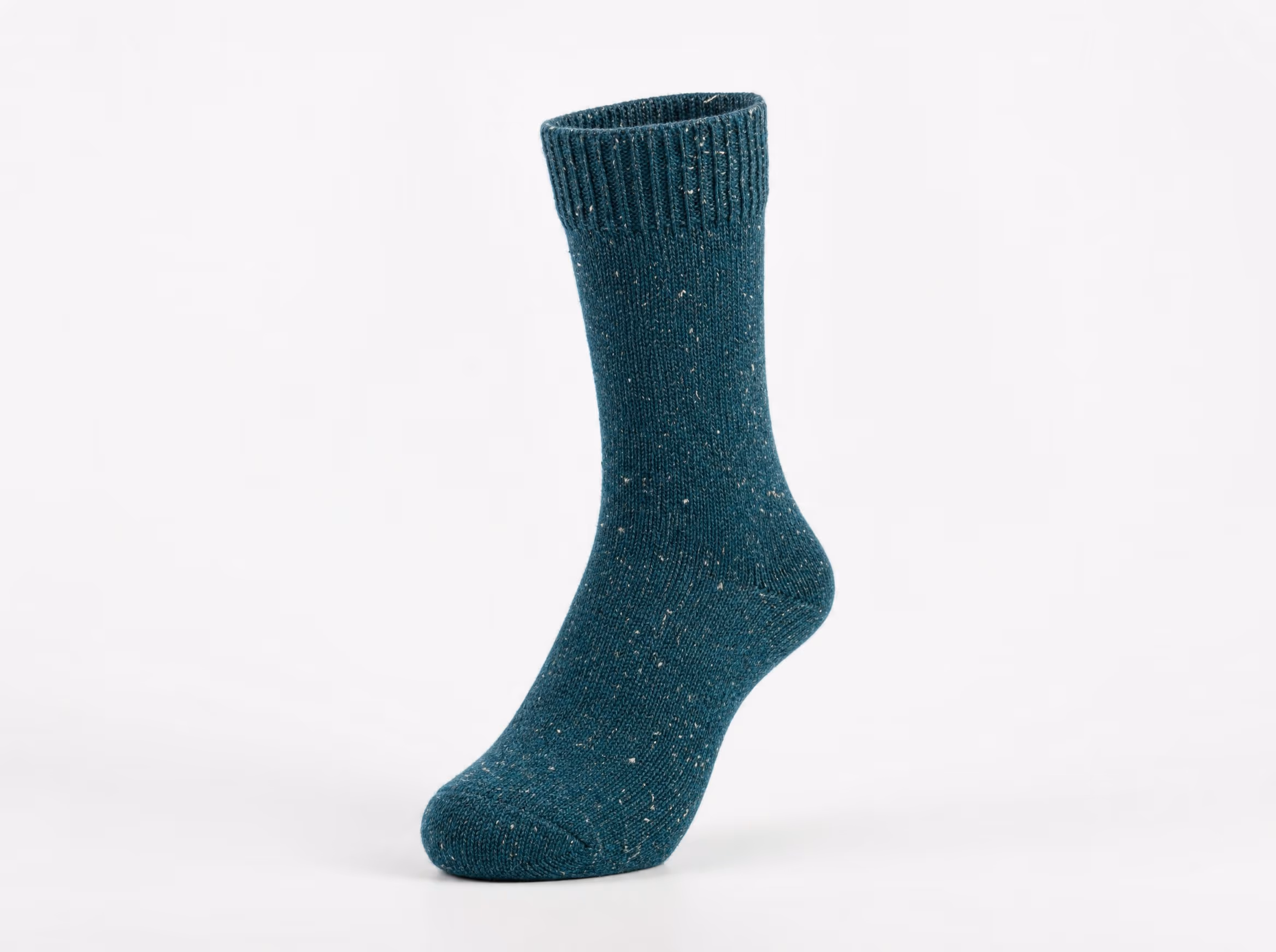 A single deep-teal crew sock in a soft natural organic-cotton knit, shown standalone on a white studio background