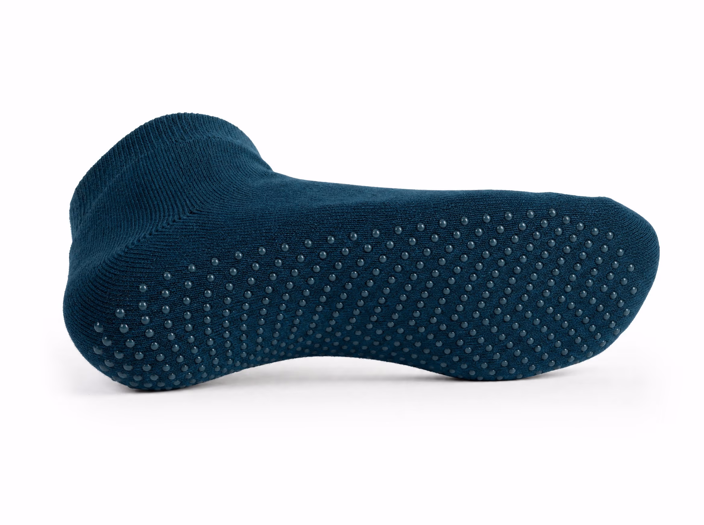 A single deep-teal ankle grip sock shown sole-up to reveal full-sole anti-slip grip dots, on a white studio background